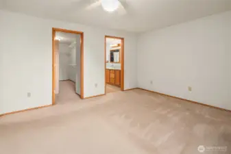 primary bedroom looking at walk in closet and bathroom