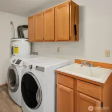 laundry room off of garage. washer, dryer and freezer are included