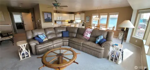 Main floor great room encompasses kitchen, dining and living area.