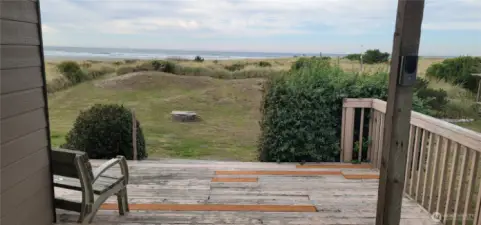 Expansive views from deck reach to beach and Pacific ocean beyond.