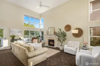 Windows abound on this light-filled main floor at all times of day. A gas fireplace at the heart of this main floor living space.
