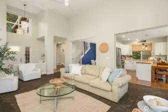 Main living room looking into the open kitchen. The floorplan is open and yet functional.