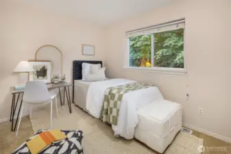 The smaller, third upper floor bedroom that fits a queen or twin bed.