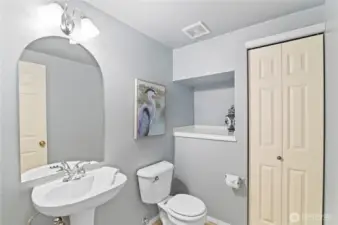 Large powder room on main floor, with large storage closet.