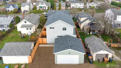 Alley access for 2-car detached garage and dedicated parking spots for townhomes.