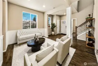 Entry and sitting area. This photo has been virtually staged.