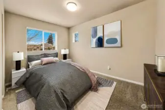 One of the bedrooms sharing the Jack-n-Jill bathroom. This photo has been virtually staged.