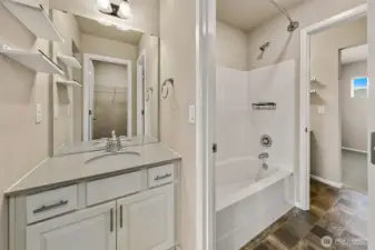Really cool set up, with walk-in closets, two separate sinks with a shared tub/shower.