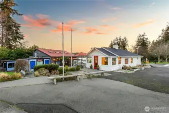 11201 NE State Hwy 104  (Tax ID#43160080010003) is a .10 acre parcel with a 512 sq ft building constructed in 1934, occupied by Driftwood Real Estate.