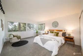 Primary bedroom with west facing windows.