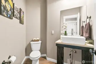 The rustic charm continues throughout even in the half bath downstairs!