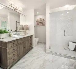 The primary bathroom is a serene and peaceful retreat with heated floors.