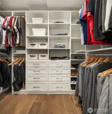 Large walk-in closet with custom storage system.