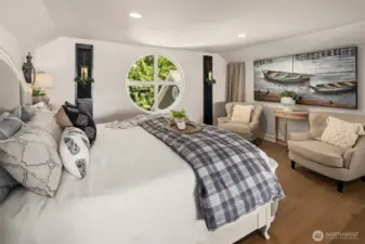 The upstairs loft. The circular window adds so much charm.