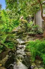 The circulating water feature and small pond add a beautiful noise to the garden.