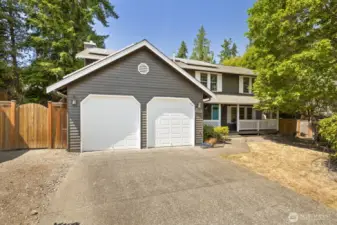 The two-car garage and driveway space gives you ample room to park multiple cars. Additionally, a Tesla wall charger is included in the sale!