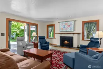 Gorgeous wood wrapped windows and french doors, which open to the beautiful outdoor living space and yard!