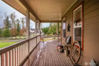 Expansive covered front deck invites your to sit and enjoy the views.
