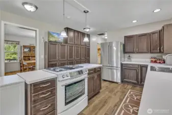 Kitchen offers plenty of room for cooking, entertaining and cabinet storage.
