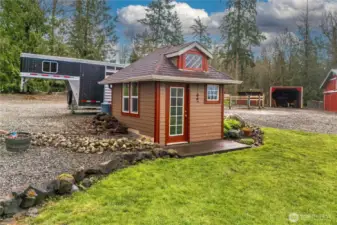 Small garden shed for extra storage and tools.
