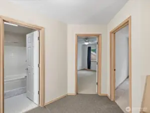 View from the top of the stairs looking towards the guest bathroom & bedrooms 1 & 2