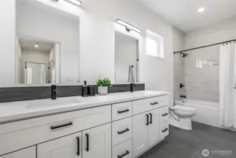 Third full bath with dual vanity.