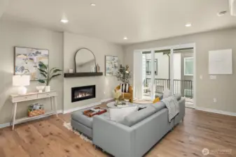 Living room opens up to large covered and heated deck for year-round enjoyment!