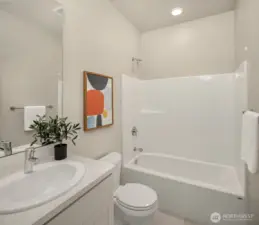 Lower level full bath as part of guest suite.