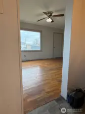 This view is from the kitchen dining area toward the living room and the front of the home.
