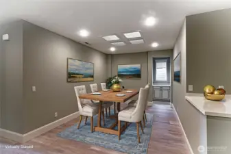 This flex space is centrally located.  Can be used for dining or additional seating area.  Notice the built-in cabinet straight ahead.