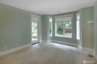 Primary suite overlooks the back yard.  Bay window plus door access to covered back patio.
