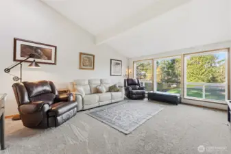 going straight down the stairs you walk up to this elegant living space with wall to wall window for private viewing of the lake