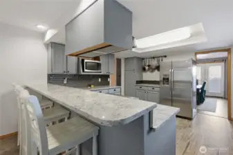 the kitchen also comes with this beautiful breakfast bar for lots of seating all around.