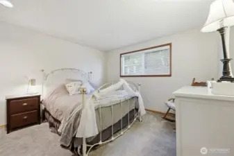 continuing down the hall you have the first bedroom