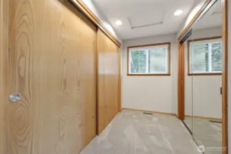 the walk in closet has  two sides for organization.