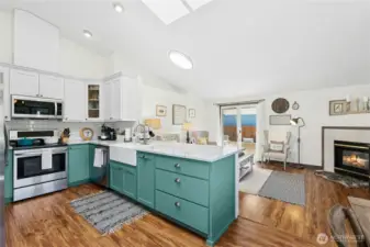 Granite counters, stainless steel appliances, custom cabinetry and farmhouse sink