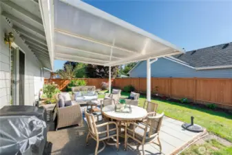 Entertainment-sized patio is covered for use in all seasons.