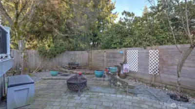 A peaceful backyard retreat with firepit