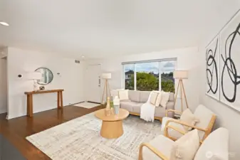 The living room windows have electric blinds controlled by a remote control for easy privacy.