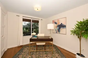 Second main floor bedroom currently staged as an office