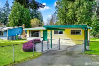 Fully fenced front and back yard. Tons of parking