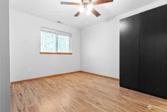 Lower level bedroom with a cabinet and a separate closet to the left (not pictured)