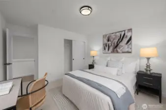 Another angle of this airy retreat! That walk-in closet is calling for your perfectly curated wardrobe, and with plenty of natural light, this space feels even more inviting.