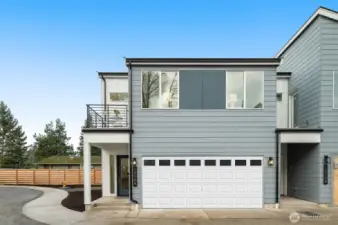 A modern masterpiece! This home blends sleek architecture with functional design, including a spacious two-car garage. Curb appeal? Absolutely.