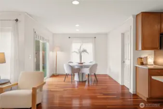 The casual dining area is accented with a window to let the outdoors in.