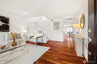 Gleaming Brazilian cherry hardwood floors at the entry and throughout the main living areas.