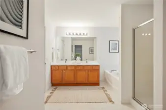 The primary bath has a dual sink vanity, soaking tub, and separate shower.