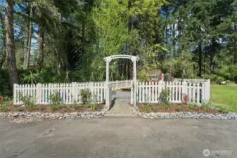 Fenced garden with raised beds, irrigation, lighting and green house with power.