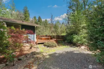 Side yard with access to/from deck.