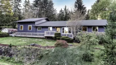 Beautiful newer exterior blue gray paint with trex decks and porch